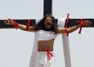 Penitent is nailed to a wooden cross during the re-enactment of the crucifixion of Jesus Christ on Good Friday